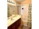 Functional bathroom with a combined shower and tub, complemented by a vanity and ample lighting at 314 Saddle Ridge Dr, Davenport, FL 33896
