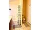 Practical bathroom featuring a tub-shower, toilet, and vanity with storage, designed for everyday convenience at 314 Saddle Ridge Dr, Davenport, FL 33896