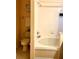 Bathroom featuring a tub/shower combination with white tile, and a neutral vanity at 314 Saddle Ridge Dr, Davenport, FL 33896