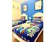 Fun ' bedroom with twin beds and playful Toy Story bedding at 314 Saddle Ridge Dr, Davenport, FL 33896