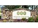 Entrance sign for Bridgewater at TownCenter, featuring stone accents and lush landscaping at 314 Saddle Ridge Dr, Davenport, FL 33896