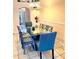 Elegant dining room featuring a glass-top table with seating for six, perfect for Gathering meals and entertaining at 314 Saddle Ridge Dr, Davenport, FL 33896