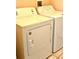 Laundry room with a white Amana washing machine and dryer set at 314 Saddle Ridge Dr, Davenport, FL 33896