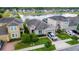 Beautiful aerial view of a home with well-maintained landscaping, nestled within a community near a tranquil lake at 3298 Stratton Cir, Kissimmee, FL 34744