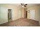 Neutral carpet in the primary bedroom with two closets and an ensuite bathroom at 3298 Stratton Cir, Kissimmee, FL 34744