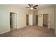 Neutral carpet in the primary bedroom with two closets and an ensuite bathroom at 3298 Stratton Cir, Kissimmee, FL 34744