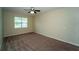 Carpeted bedroom includes ceiling fan and window with outside views at 3298 Stratton Cir, Kissimmee, FL 34744