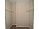 Walk-in closet featuring metal shelves for easy organization at 3298 Stratton Cir, Kissimmee, FL 34744