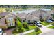 Exterior elevation featuring manicured lawn and landscaping near a lake at 3298 Stratton Cir, Kissimmee, FL 34744