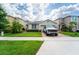 Well-maintained home featuring a brick driveway and lush lawn at 3298 Stratton Cir, Kissimmee, FL 34744