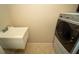 Practical laundry room area with a utility sink for added convenience at 3298 Stratton Cir, Kissimmee, FL 34744