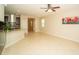Open living room features tile flooring, a ceiling fan, and a modern color palette at 3298 Stratton Cir, Kissimmee, FL 34744