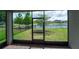 Enjoy the outdoors from this screened lanai with views of the pond and backyard at 3298 Stratton Cir, Kissimmee, FL 34744