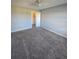 Well-lit bedroom includes carpeting, ceiling fan, and a spacious closet at 4301 Lizshire Ln # 306, Orlando, FL 32822