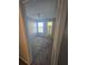 Neutral bedroom featuring comfortable carpeting, ceiling fan, and natural light at 4301 Lizshire Ln # 306, Orlando, FL 32822