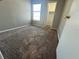 Bedroom with window, closet and neutral carpet at 4301 Lizshire Ln # 306, Orlando, FL 32822