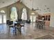 Spacious clubhouse featuring high ceilings, tile flooring, and abundant natural light through large windows at 4301 Lizshire Ln # 306, Orlando, FL 32822