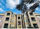 Charming exterior of a condo complex with wood facade and ample windows at 4301 Lizshire Ln # 306, Orlando, FL 32822
