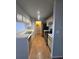 Galley kitchen featuring white cabinets and modern black appliances at 4301 Lizshire Ln # 306, Orlando, FL 32822