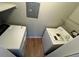 Convenient in-unit laundry area with washer and dryer hookups and storage shelves at 4301 Lizshire Ln # 306, Orlando, FL 32822