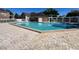 Beautiful community pool surrounded by well-maintained pool deck at 4301 Lizshire Ln # 306, Orlando, FL 32822
