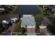 Aerial view of home with landscaped yard and lake view in a desirable community at 4337 Summer Breeze Way, Kissimmee, FL 34744