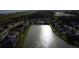 Scenic aerial view showcasing a community with a large pond and well-maintained homes at 4337 Summer Breeze Way, Kissimmee, FL 34744