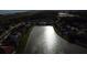 Scenic aerial view showcasing a community with a large pond and well-maintained homes at 4337 Summer Breeze Way, Kissimmee, FL 34744