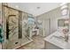 Modern bathroom featuring a glass shower, double sinks, and vanity at 4337 Summer Breeze Way, Kissimmee, FL 34744