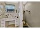 Bathroom features a sink vanity with drawers, a window, and a separate toilet room at 4337 Summer Breeze Way, Kissimmee, FL 34744