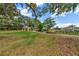 Picturesque community green space with a gazebo and mature oak trees at 4337 Summer Breeze Way, Kissimmee, FL 34744