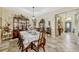 Formal dining room with ceramic tile, neutral paint, and decorative china cabinet at 4337 Summer Breeze Way, Kissimmee, FL 34744