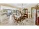 Formal dining room with ceramic tile flooring, neutral paint, and open to the living room at 4337 Summer Breeze Way, Kissimmee, FL 34744
