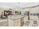 Spacious kitchen with granite countertops, stainless steel appliances, and barstool seating at 4337 Summer Breeze Way, Kissimmee, FL 34744