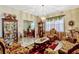 Comfortable living room featuring tile flooring, decorative accents, and natural lighting at 4337 Summer Breeze Way, Kissimmee, FL 34744