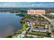 Breathtaking aerial view showcasing the community's proximity to Park Avenue and tranquil lakeside setting at 525 Georgetown Dr # D, Casselberry, FL 32707