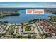Stunning aerial view showcasing the community's proximity to UCF Campus and serene lakefront living at 525 Georgetown Dr # D, Casselberry, FL 32707