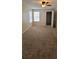 Bedroom featuring neutral carpet, closet, windows, and ceiling fan at 5501 Rosebriar Way # 111, Orlando, FL 32822