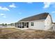 Backyard featuring a screened lanai and a well-maintained exterior at 5512 Hamlin Close, Davenport, FL 33896