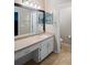 Bathroom featuring granite counter, tiled floors, and modern fixtures at 5512 Hamlin Close, Davenport, FL 33896