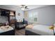 Bright Bedroom with two cribs, closet storage and shuttered window at 5512 Hamlin Close, Davenport, FL 33896