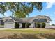 Charming single Gathering home featuring a well-manicured lawn and two car garage at 5512 Hamlin Close, Davenport, FL 33896