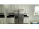 The kitchen features stainless steel appliances, and white cabinets at 5624 Beggs Rd, St Cloud, FL 34771