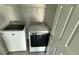 Well-lit laundry area features a Maytag washer and dryer set and shelving space for organization at 5624 Beggs Rd, St Cloud, FL 34771