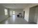 Large living room featuring light tile flooring and neutral walls at 5624 Beggs Rd, St Cloud, FL 34771