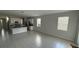 Spacious and well-lit open floor plan with tile floors at 5624 Beggs Rd, St Cloud, FL 34771