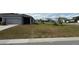 View of the front yard with green grass at 5624 Beggs Rd, St Cloud, FL 34771
