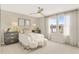 Bright bedroom featuring carpeted floors, neutral-toned walls, stylish furniture and a large window at 6413 Clover St, Lake Hamilton, FL 33851