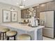 Modern kitchen with white countertops, stainless steel appliances and oversized kitchen island at 6413 Clover St, Lake Hamilton, FL 33851