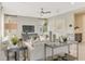 Cozy living room with neutral-toned furniture, a ceiling fan, recessed lighting and stylish decor at 6413 Clover St, Lake Hamilton, FL 33851